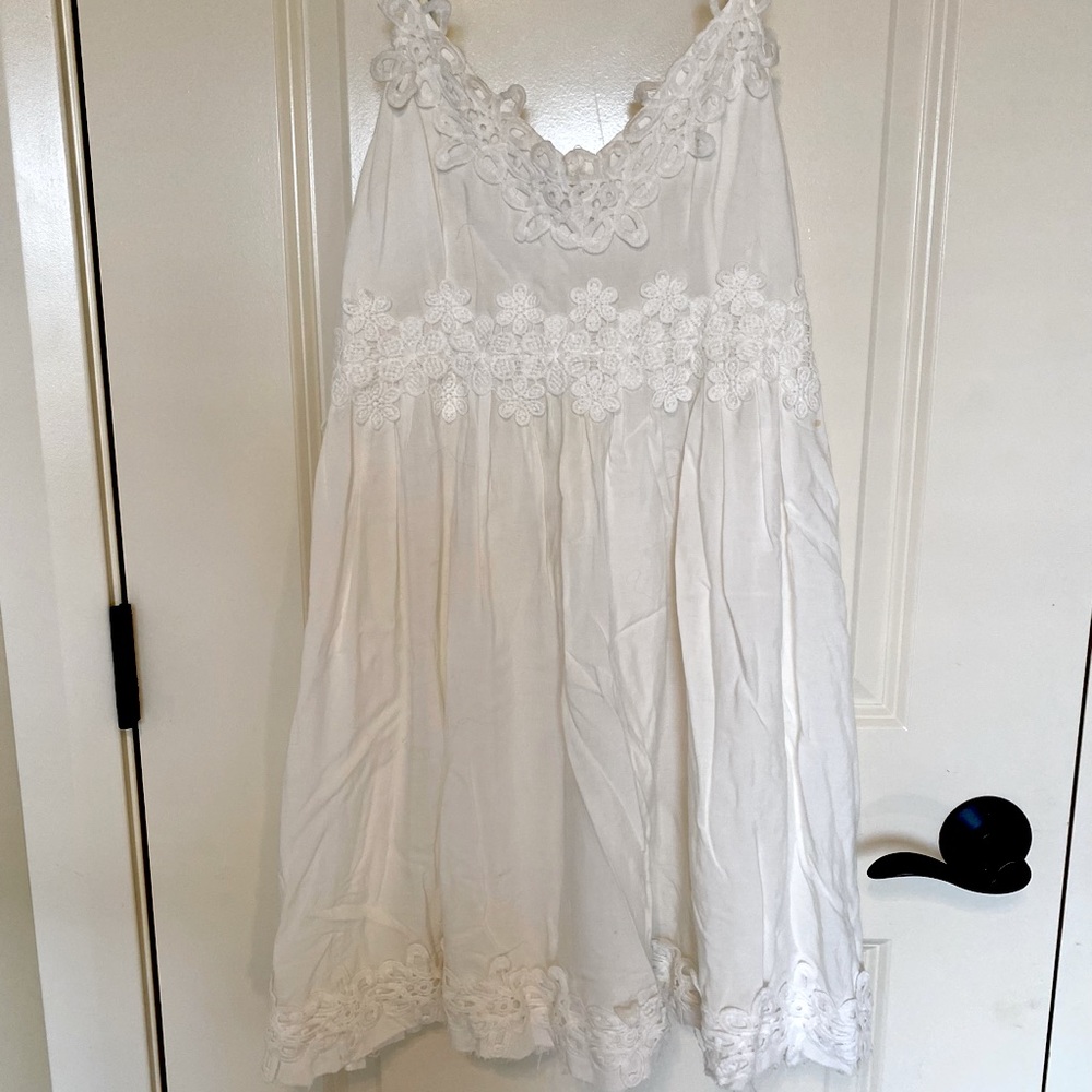 White zip up spaghetti strapped dress with lace details